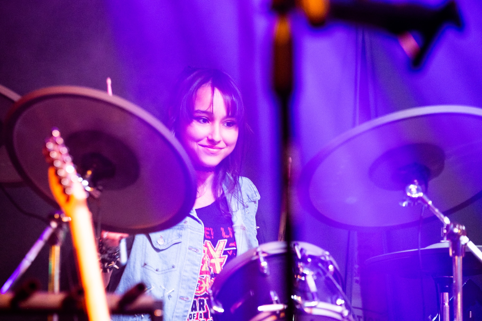 Student performing drums at 70s Groove concert